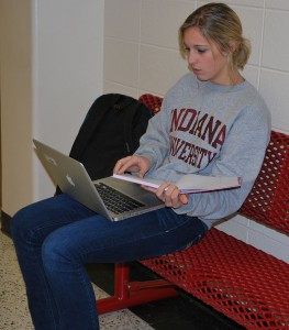 Sophomore Emily Miller, tries to finish her homework before her next period class. Photo by: Elizabeth Gallardo