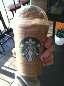 Junior Taylor Fulton enjoys taking photographs of his Starbucks that he gets in the morning. Photo by: Courteney Keller 