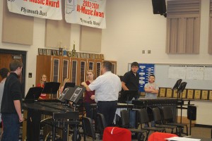 Mr. Ames starts to teach the members in Winter Percussion Ensemble their music. Photo by: Jon Sommers