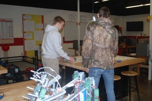 Seniors Corey Wallace and Will Sibal test out their designs for motorized vehicles for their robotics class. Photo by: Isabelle Miller