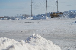 Here Plymouth High School's parking lot is being cleared of snow. Photo by: Chase Holzwart