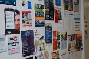 The wall beside the Guidance Office holds posters for colleges and programs.  Students can find out information by looking at this wall and talking to their counselors. 