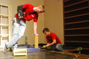 Two students from tech theater start building the set for the play. Photo by: Cameron Maddox