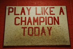 The boys football team has a tradition of tapping this sign before they play a game. Photo by: Cameron Maddox