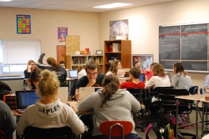 Students assiduously work in a traditional English classroom. Photo by: Emory Smith.  