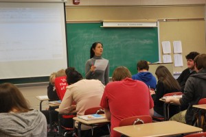 Guan Lao Shi, directing the class from the front of the room, explains a question that a student was confused on. Photo by: Daisy Lewis