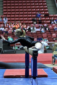 Cassi Quissell competes in Indiana's State Gymnastics Meet on March 26, 2014. Her favorite motto, "When you’re not preparing for a championship, someone else is” helped her persevere through this moment. Photo contributed by: Cassi Quissell