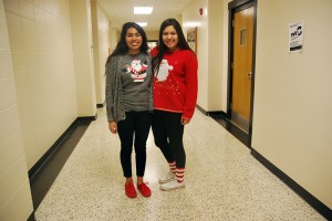 Turning ugly sweater to fancy sweaters Crysta Cantero and Elia fuigeroa both wear Christmas sweaters for the holidays.  Photo By: Maria Ortiz 