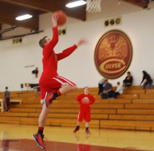 Basketball player Payton Skirvin doing warm up for the tournament against Tippevalley, Culver Military Academy, and Triton. Photo by: Janessa Salazar 