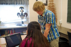 Eric Burch helping a student.