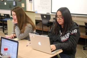 Getting back into the swing of things, Alicia finishes her article as well as helps her group with their work. Photo by: Janessa Salazar