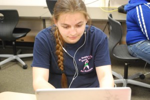 Students listening to music in class.  Photo By: Emma Daniels