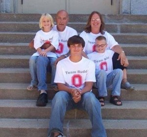 In this photo we were wearing shirts that say "Team Rudd." This was the first year we did the shirt. My grandparent's last name is Rudd and everyone who is related to them got shirts. He was holding his little nephew's hand. Photo contributed by: Eric