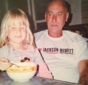 In this picture, my dad was holding my sister on her lap while she was eating. Photo contributed by: Eric Burch