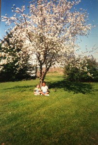 Senior Janessa Salazar and her sister Mariah sit under an apple tree in their back yard. Photo Contributed by: Janessa Salazar