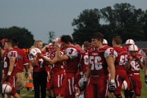 Senior Trenton Garza (56) and senior Logan Crum (3) take a break from playing on the sidelines alongside other players. Photo contributed by: Chelsea Baca.